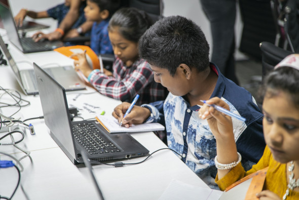 Children working together at computer