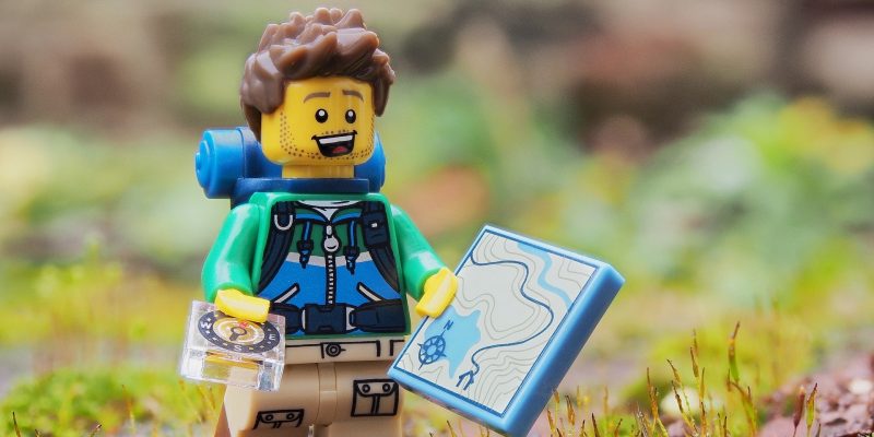 A LEGO figurine in hiking gear