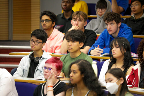 A group of young people in a lecture hall.