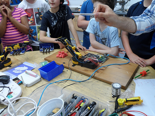 A group of learners do physical computing in the primary school classroom.