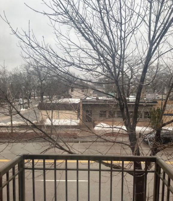 Springtime in Minneapolis, Minnesota image of snowy scene from deck.